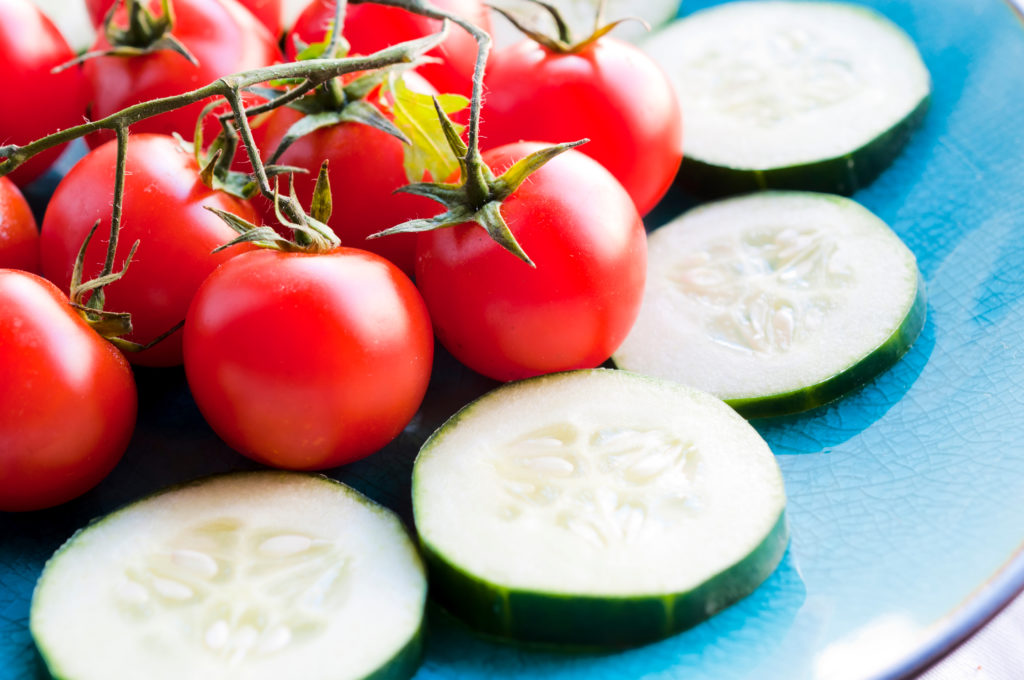 Fresh cherry tomato on the daylight. Selective focus on the tomato