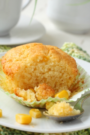 24260626 - freshly baked corn muffins on the plate