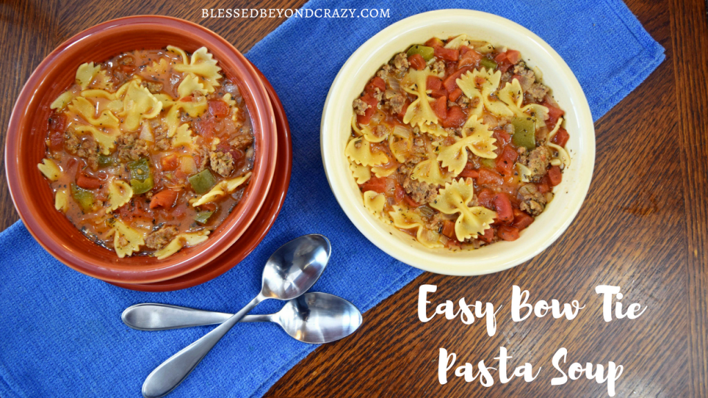 Two bowls filled with Easy Bow Tie Pasta Soup.