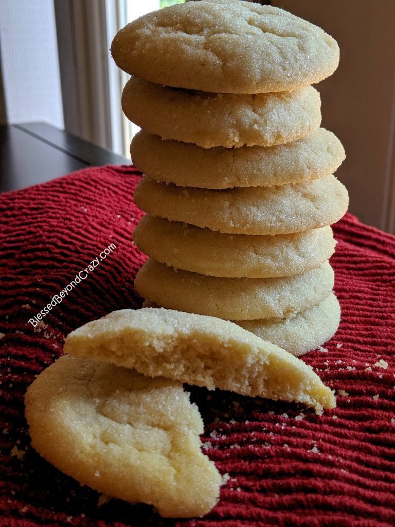 Tall stack of Grandma's Old-Fashioned Sugar Cookies and a single sugar cookies