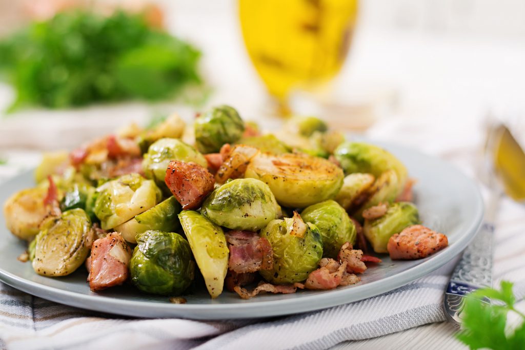 Close up of cooked brussel sprouts and bacon