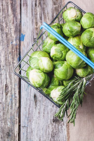 Top view of brussel sprouts and rosemary