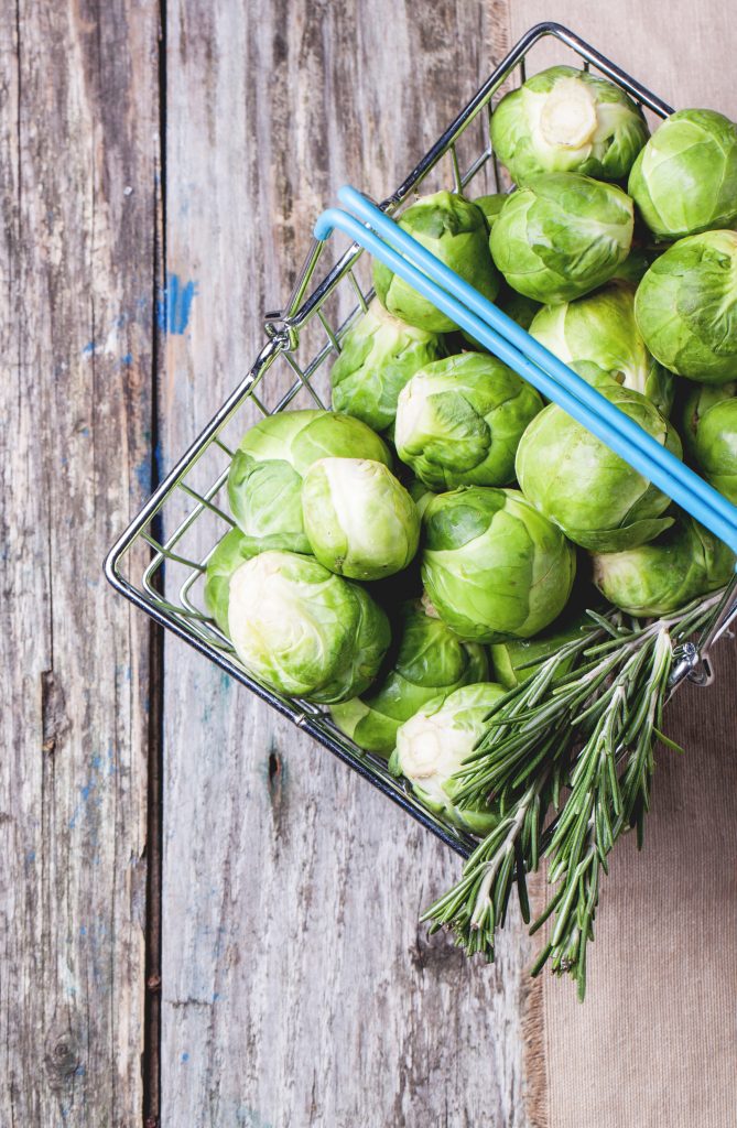 Top view of brussel sprouts and rosemary