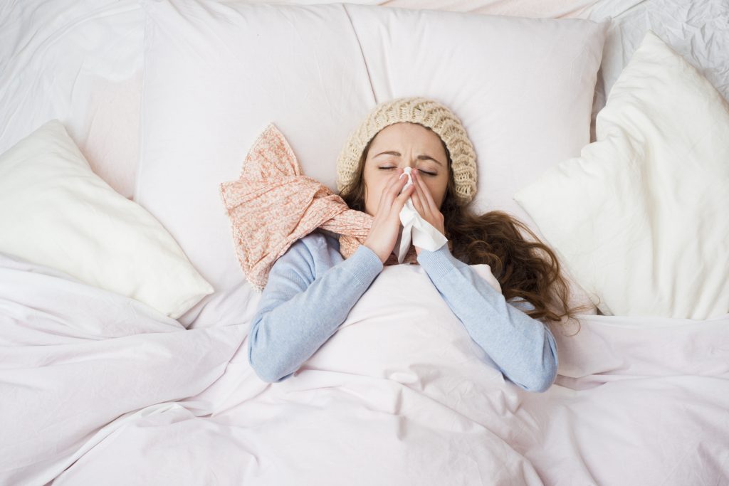 Sick woman who needs a bowl of All-Natural Chicken Noodle Soup