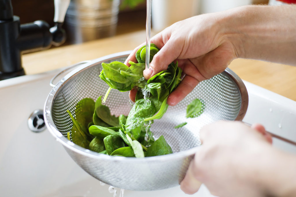 Prepping fresh spinach. 