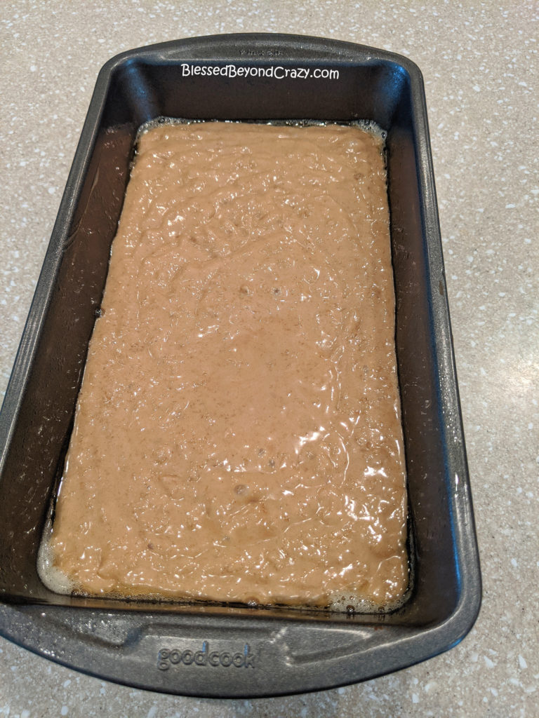 Loaf pan of Easy Oatmeal Bread batter ready to bake. 