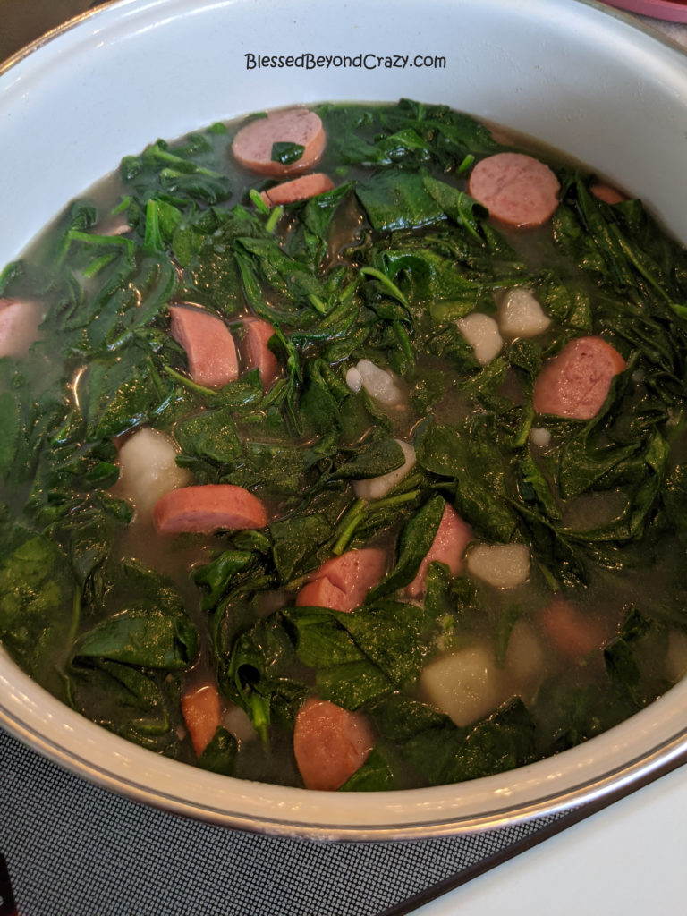 Simmering stockpot of Grandma's Old-Fashioned Spinach Stew