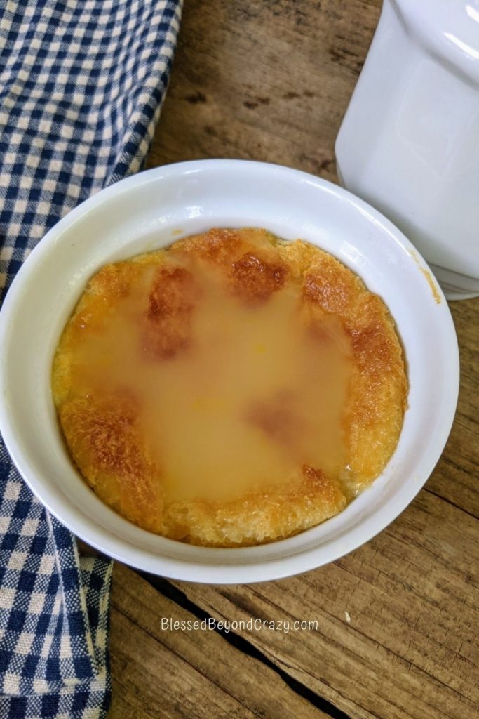 Single ramekin of Lemon Bread Pudding ready to serve.