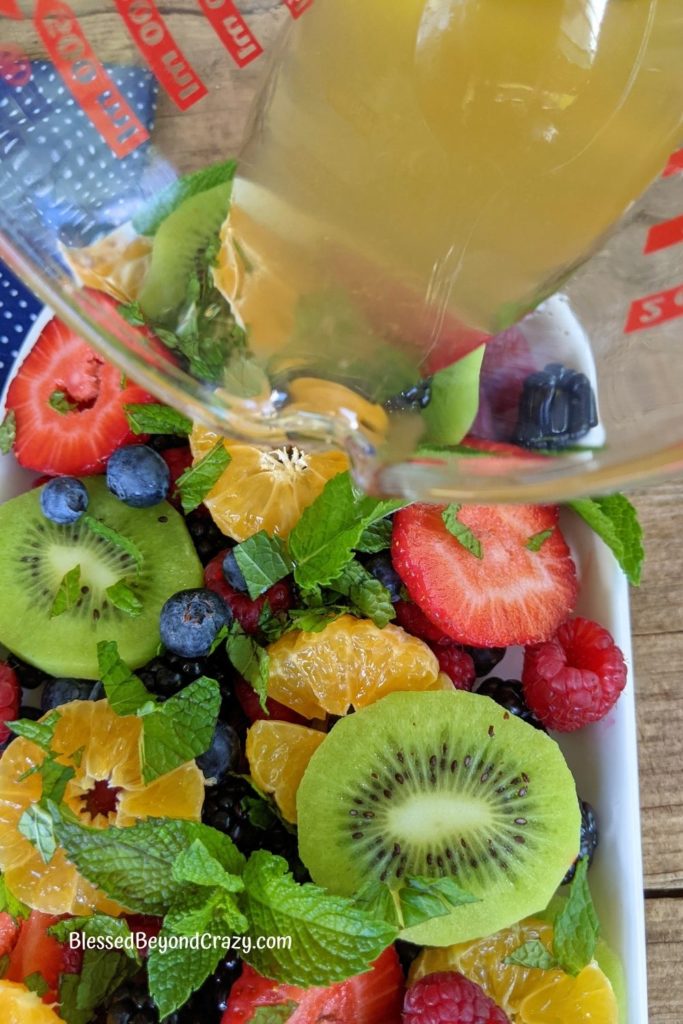 Mason Jar Fruit Salad with Strawberry Mint Dressing - Spoonful of
