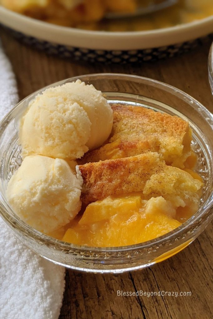 Close up of an individual serving of peach cobbler