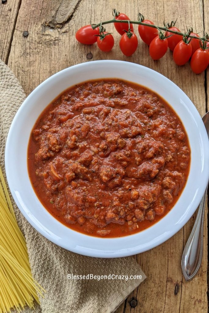 vertical view of the best pasta sauce with tomatoes and spaghetti noddles