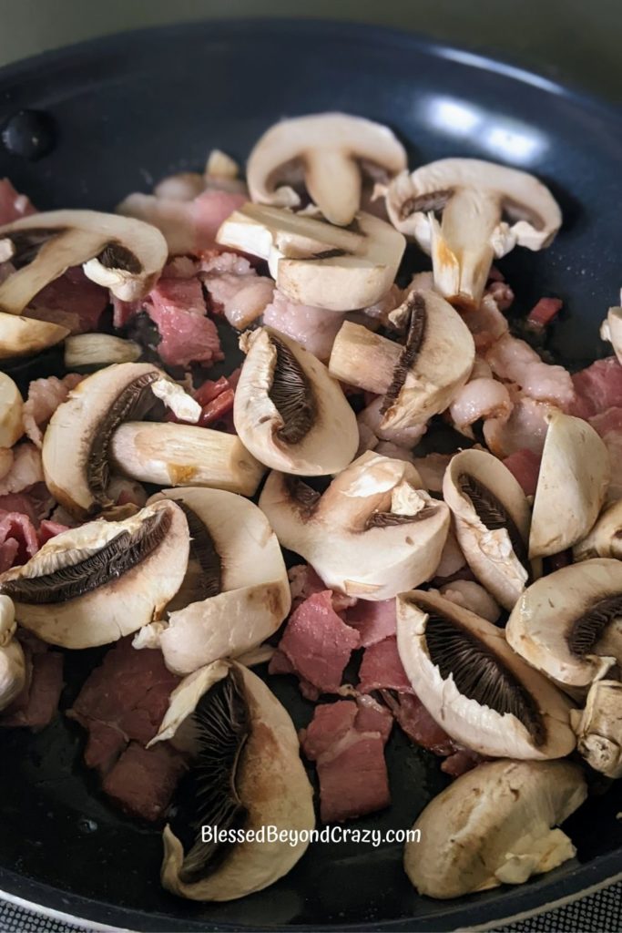 Bacon and Mushrooms cooking in skillet