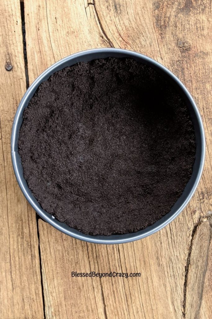 Overhead view of Oreo crust in a springform pan