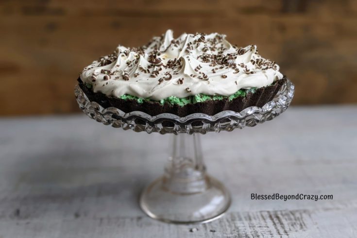 Close up view of Chocolate Mint Tart on a pretty cake stand