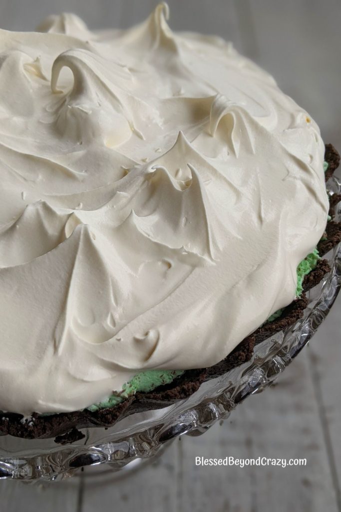 Whipped topping covering top of Chocolate Mint Tart