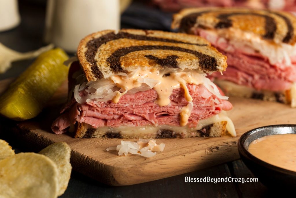 Close-up view of half of a delicious Reuben sandwich.