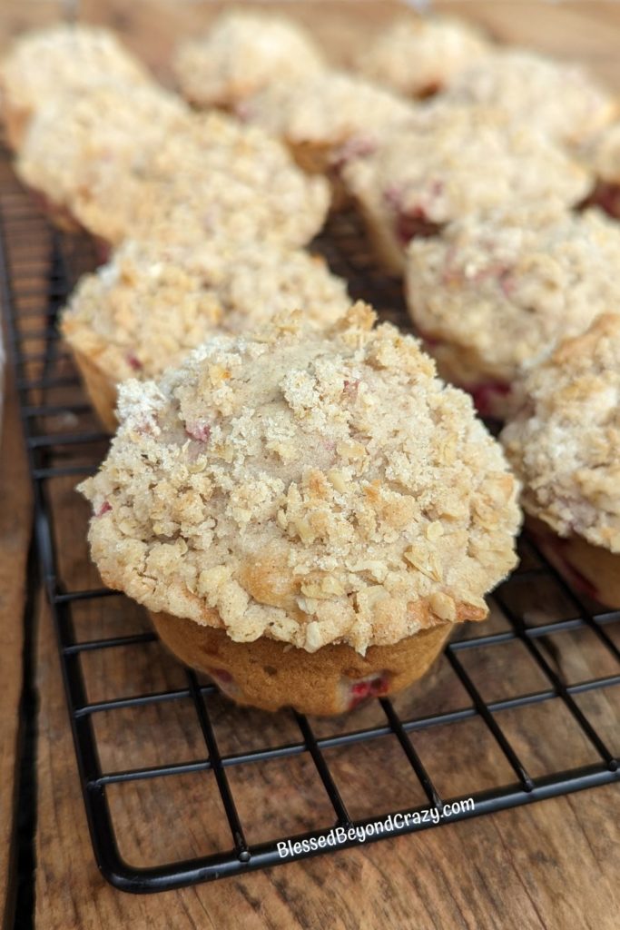Close up view of cooling Raspberry Streusel Muffins on a wire rack