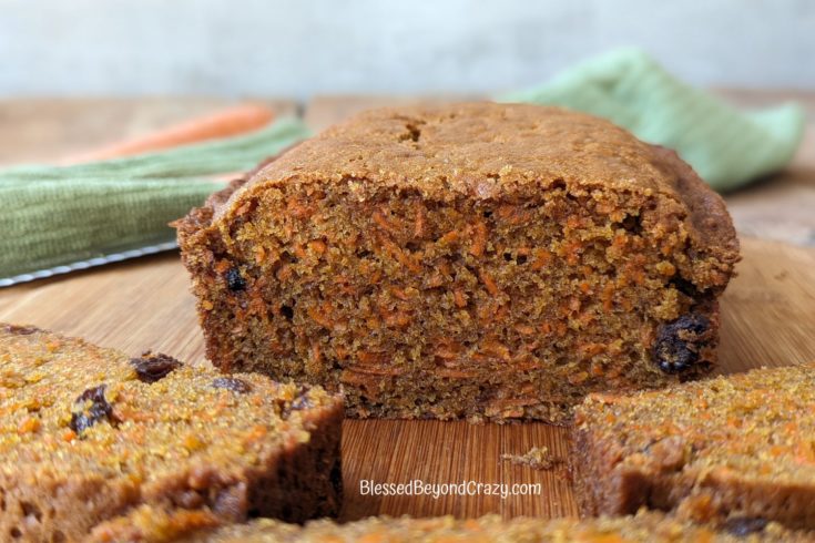 Close up side view of a loaf of carrot bread.