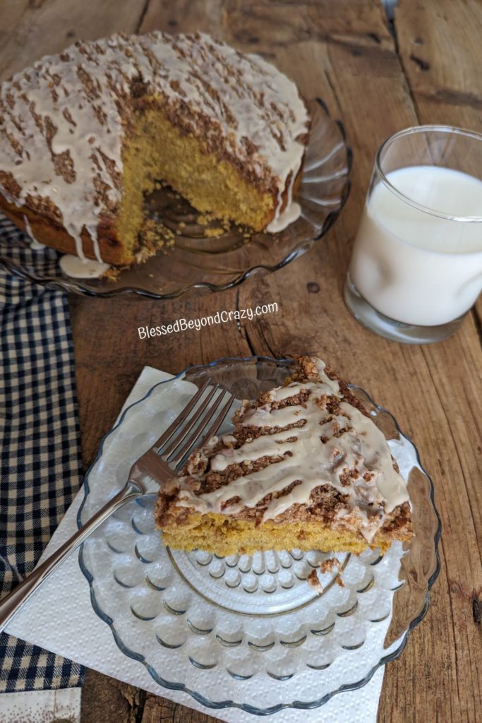 Overhead view of cake, glass of milk, and fork.