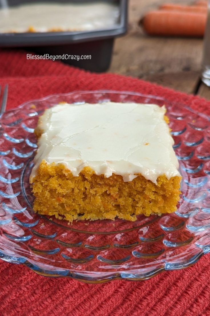 Close up view of an individual serving of carrot bars with orange zest.