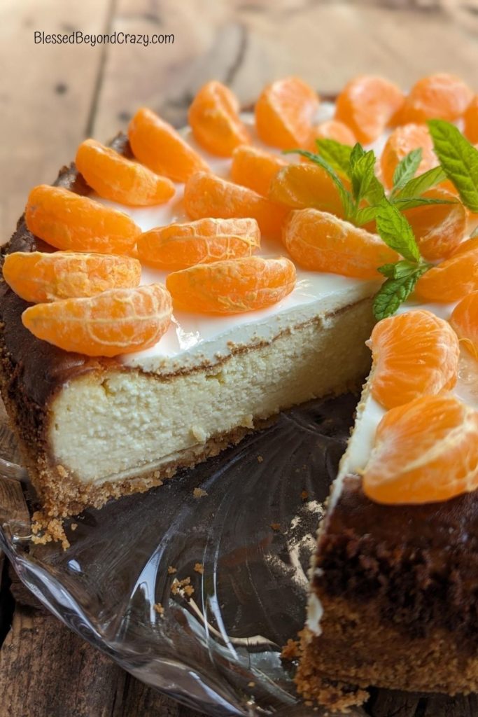 Close up side view of cut cheesecake.