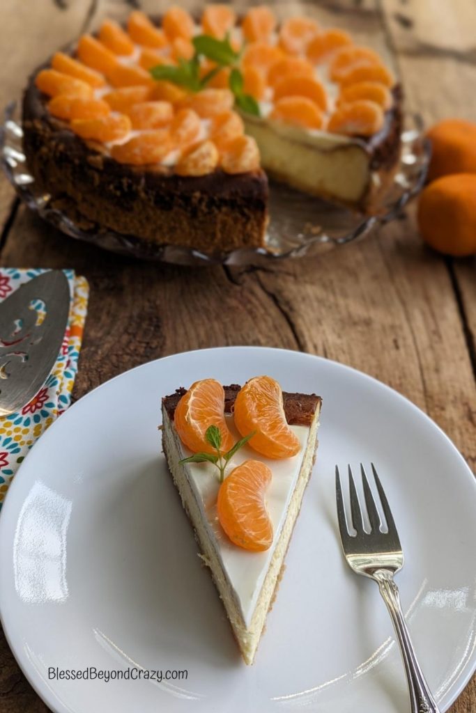Front view of Orange White Chocolate Cheesecake with one serving.