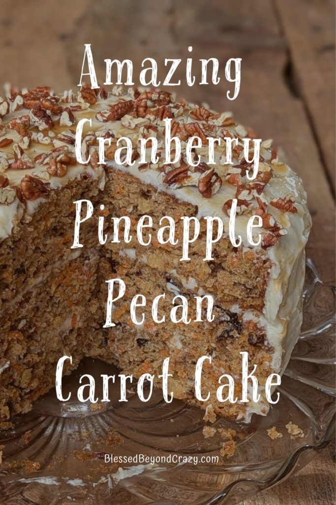 Pinterest image of whole cranberry pineapple pecan carrot cake with two slices cut away.