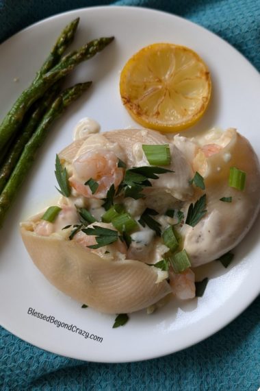 Close up photo of serving of shrimp and crab stuffed pasta.