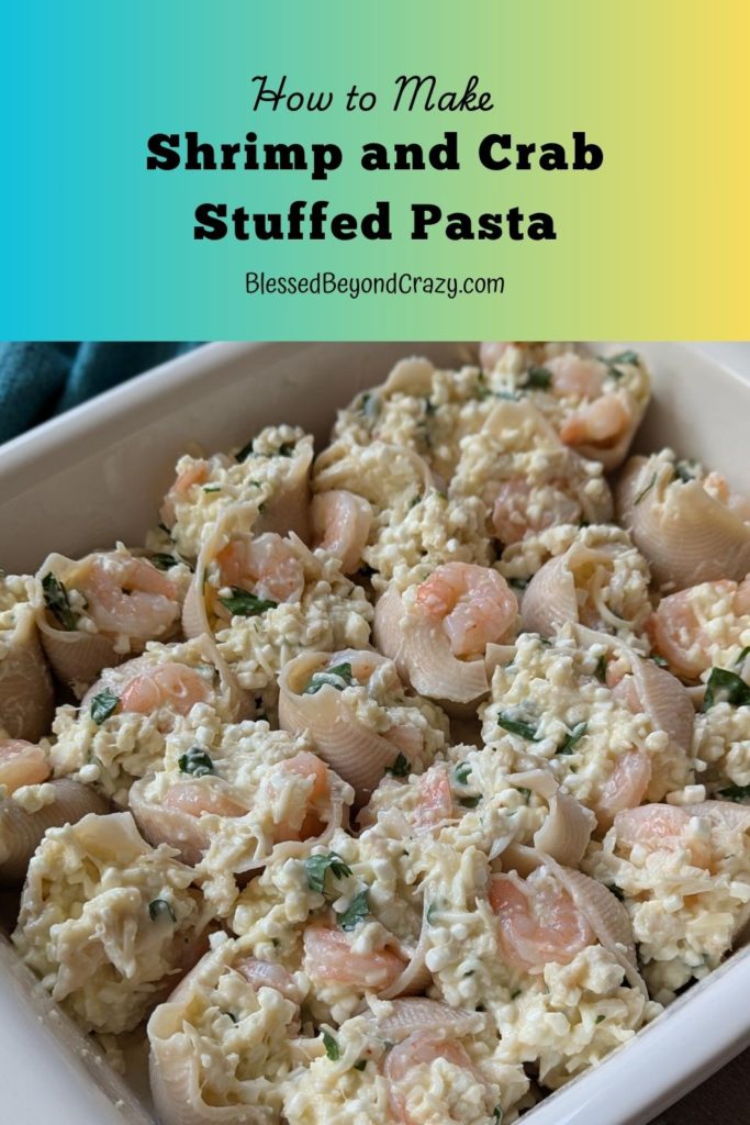 Pinterest image of baking dish filled with stuffed shells with shrimp and crab meat.