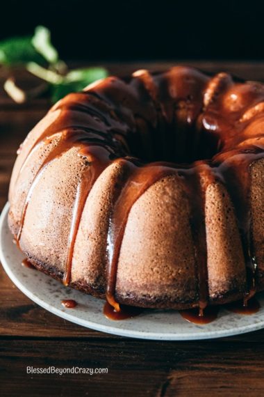 Side view of a freshly made apple cider spice cake