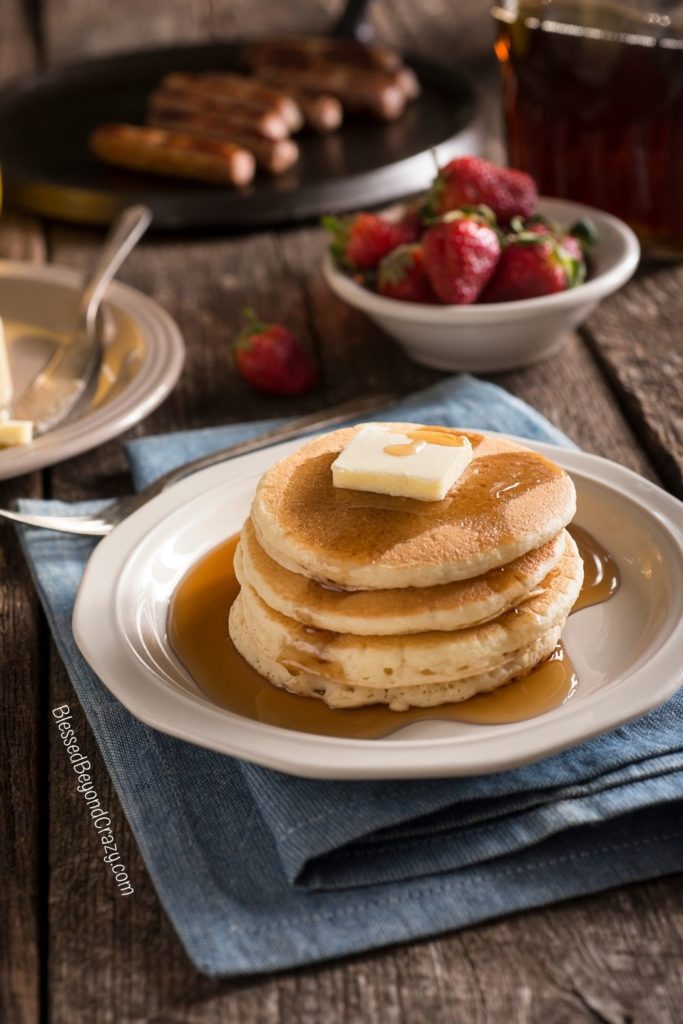 Photo of ready to eat three-stack of pancakes.