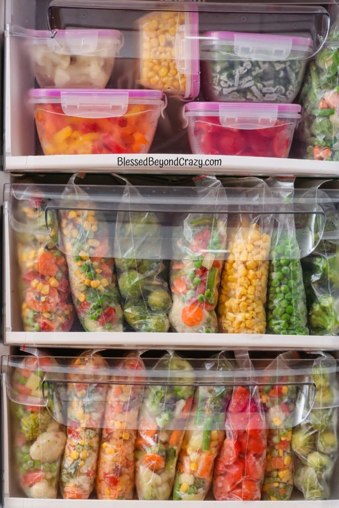 Front view of shelves full of frozen vegetables.